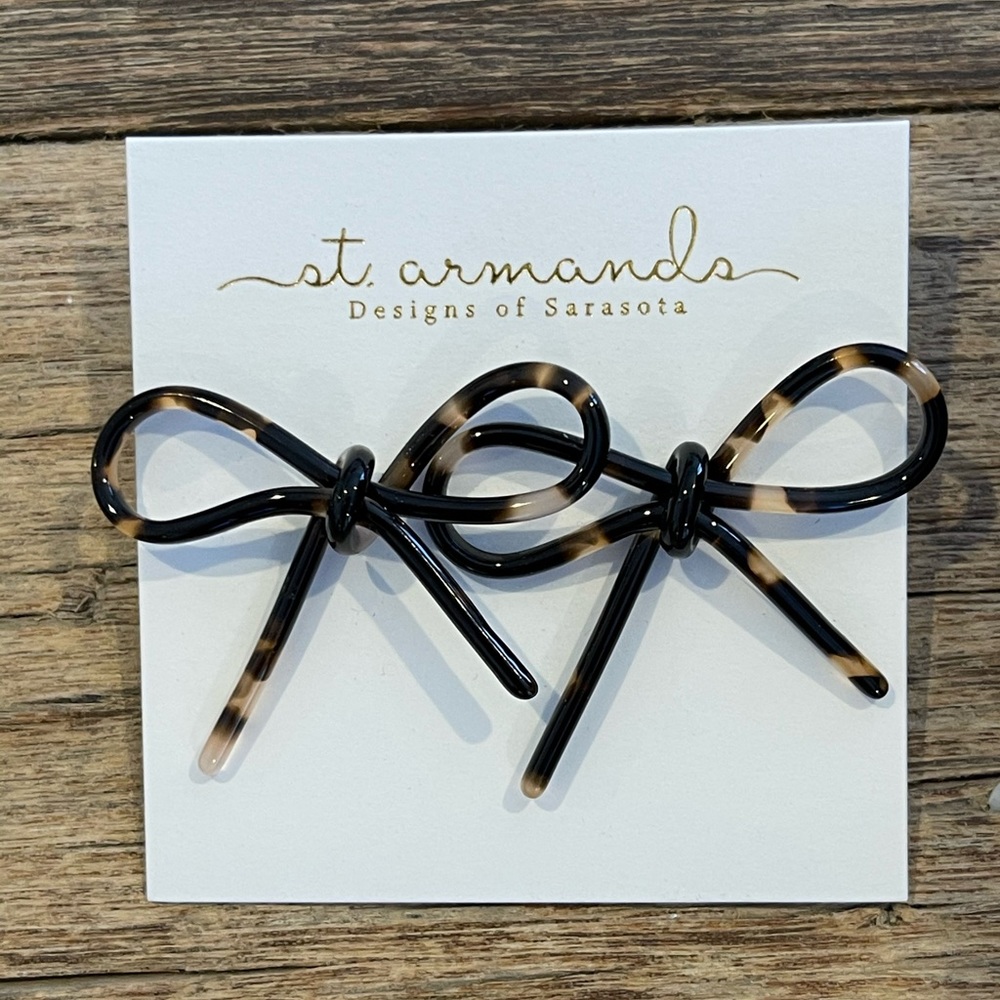 St.Armand’s bow acrylic earrings